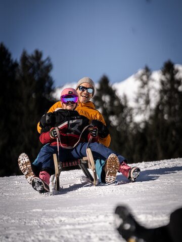 sledging with child in the Zillertal