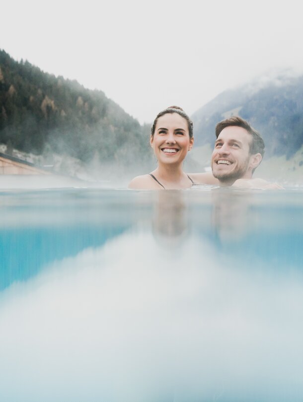 couple in infinity pool in Tyrol