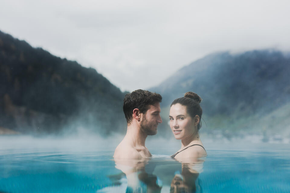 couple in the outdoor pool in Zillertal